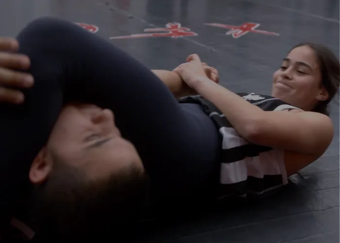 A grappling exchange during supervised sparring