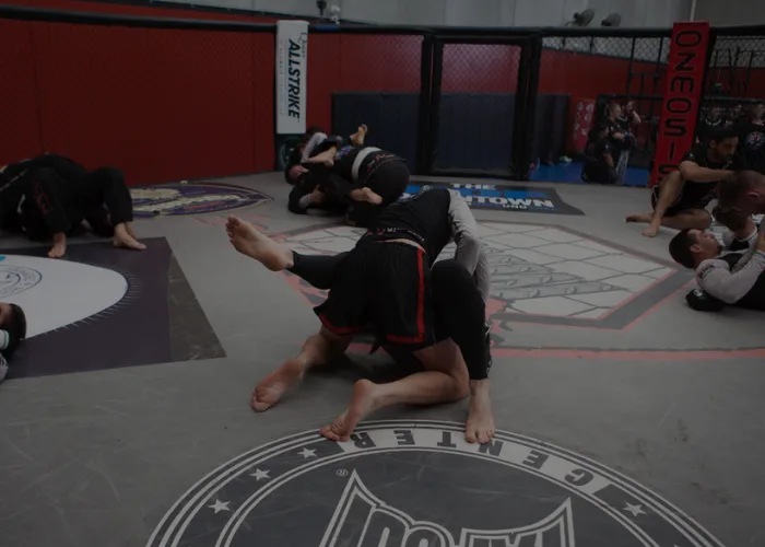 Ground-work rounds during an MMA class