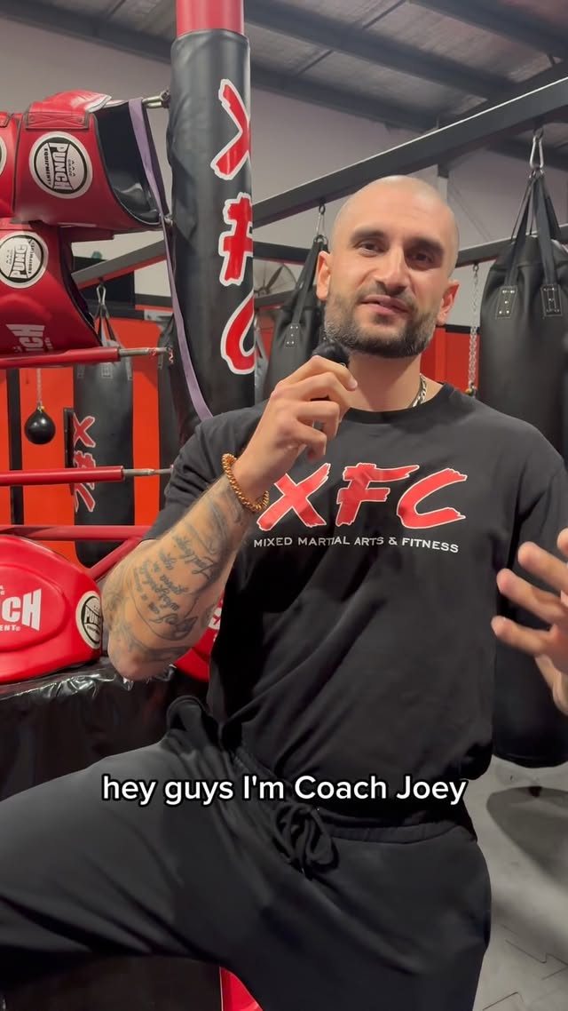 An XFC coach introducing the junior program