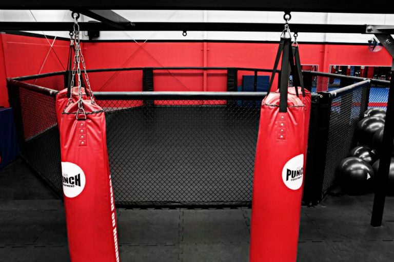 Row of heavy bags beside the cage